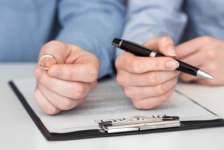 Signing on divorce papers Spousal Support img  Topinka Law