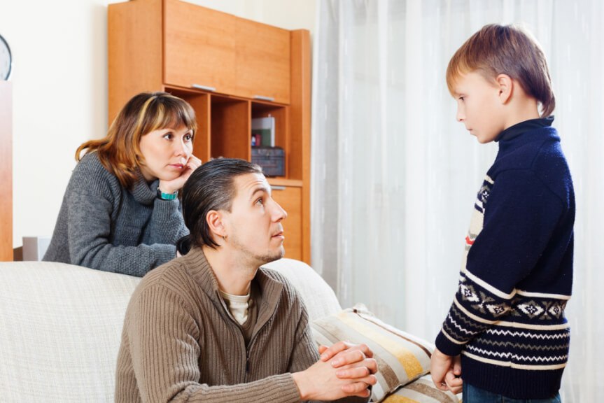 Child, stepparent, and parent discussing the day.
